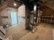 Unfinished attic space featuring framed walls, HVAC ductwork, and exposed wood beams at 120 Firefly Ln, Louisburg, NC 27549