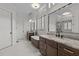 Luxurious bathroom with double vanities, soaking tub, and modern fixtures at 120 Firefly Ln, Louisburg, NC 27549