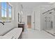 Modern bathroom with soaking tub, glass shower, and stylish fixtures at 120 Firefly Ln, Louisburg, NC 27549