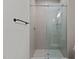 Bathroom featuring a shower with glass door and subway tile surround at 120 Firefly Ln, Louisburg, NC 27549