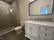 Bathroom features a tiled stand up shower, updated vanity with marble countertop, and new fixtures at 120 Firefly Ln, Louisburg, NC 27549