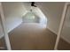 Finished bonus room boasts vaulted ceilings, large windows, recessed lighting, and neutral carpet at 120 Firefly Ln, Louisburg, NC 27549