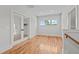 An empty room with hardwood floors and a staircase at 120 Firefly Ln, Louisburg, NC 27549