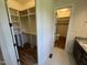 Spacious walk-in closet with custom shelving and easy access from the ensuite bathroom at 120 Firefly Ln, Louisburg, NC 27549