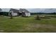 Spacious home with pristine lawn, landscaping, and exterior stone accents at 120 Firefly Ln, Louisburg, NC 27549