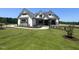 Beautiful new construction featuring stone accents, board and batten, and a professionally landscaped yard at 120 Firefly Ln, Louisburg, NC 27549