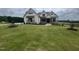 Charming two-story home with well-manicured lawn and stone accents at 120 Firefly Ln, Louisburg, NC 27549