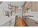 Gourmet kitchen featuring a farmhouse sink, stainless steel appliances, custom cabinets, and a gas range at 120 Firefly Ln, Louisburg, NC 27549