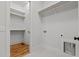 Laundry room with shelving, wood floors, and laundry hook-ups at 120 Firefly Ln, Louisburg, NC 27549