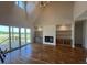 Bright living room with a fireplace, built-in shelving, and sliding doors to the outdoor space at 120 Firefly Ln, Louisburg, NC 27549