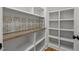 Pantry featuring custom white shelving, beautiful backsplash, and a butcher block counter at 120 Firefly Ln, Louisburg, NC 27549