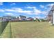Expansive backyard featuring a black iron fence and wooden privacy fence surrounding a well-manicured lawn in a neighborhood at 121 Nate Ct, Wake Forest, NC 27587