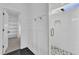 Modern bathroom with an open shower with a glass door, designer tile, and bronze fixtures at 121 Nate Ct, Wake Forest, NC 27587