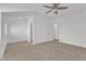 Bedroom features neutral carpet, ceiling fan and entry to the ensuite bathroom at 121 Nate Ct, Wake Forest, NC 27587