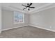 Neutral bedroom featuring recessed lighting, plantation shutters, and carpeted floors at 121 Nate Ct, Wake Forest, NC 27587