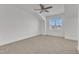 Bedroom features neutral carpet, ceiling fan and large window overlooking the outdoors at 121 Nate Ct, Wake Forest, NC 27587