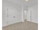 Bedroom features neutral carpet, double door closet and neutral color pallete at 121 Nate Ct, Wake Forest, NC 27587