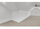 Attic bonus room with carpeted floor, ceiling fan, and good natural light at 121 Nate Ct, Wake Forest, NC 27587