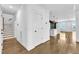 Inviting entryway with hardwood floors leads to an open-concept kitchen and living area at 121 Nate Ct, Wake Forest, NC 27587