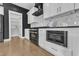 Kitchen featuring white cabinetry, stainless steel appliances, and marble backsplash at 121 Nate Ct, Wake Forest, NC 27587