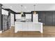 Kitchen with a center island, stainless steel refrigerator, and black accents at 121 Nate Ct, Wake Forest, NC 27587