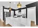 Kitchen featuring a large island with white cabinets and gold pendant lights at 121 Nate Ct, Wake Forest, NC 27587