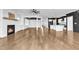 Open concept living room with fireplace, adjacent to modern kitchen and dining area at 121 Nate Ct, Wake Forest, NC 27587