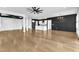 Open-concept living room flows into the kitchen with hardwood floors and unique ceiling design at 121 Nate Ct, Wake Forest, NC 27587