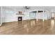 Cozy living room with a fireplace, hardwood floors, and natural light from windows at 121 Nate Ct, Wake Forest, NC 27587