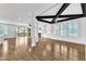 Spacious living room with hardwood floors, fireplace, and abundant natural light at 121 Nate Ct, Wake Forest, NC 27587