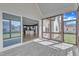 Screened porch with a view into the kitchen, seamlessly blending indoor and outdoor living at 121 Nate Ct, Wake Forest, NC 27587
