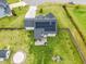 Home featuring a large backyard, solar panels, patio area, and play area for outdoor enjoyment at 137 Clydes Point Way, Wendell, NC 27591