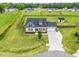 Expansive property featuring a well-maintained lawn, a charming home, and a long driveway at 137 Clydes Point Way, Wendell, NC 27591