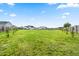 Vast backyard enclosed by a wooden fence, offering privacy and plenty of room for recreation or gardening opportunities at 137 Clydes Point Way, Wendell, NC 27591