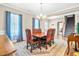 Inviting dining room featuring a wood table, decorative chairs, and elegant chandelier at 137 Clydes Point Way, Wendell, NC 27591