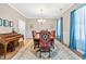 Formal dining room featuring a wooden table, decorative chairs, and an elegant chandelier at 137 Clydes Point Way, Wendell, NC 27591