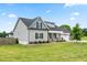 Stylish two-story home featuring gray siding, a well-kept lawn, and a convenient two car garage at 137 Clydes Point Way, Wendell, NC 27591