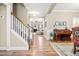 Inviting entryway with hardwood floors, stairway, and stylish decor leading to a cozy living space at 137 Clydes Point Way, Wendell, NC 27591