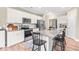 Well-equipped kitchen with granite countertops, island seating, and stainless steel appliances at 137 Clydes Point Way, Wendell, NC 27591