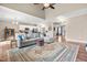 Comfortable living room featuring a large sectional sofa and hardwood floors at 137 Clydes Point Way, Wendell, NC 27591