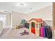 Bright playroom includes a playhouse and furniture and toys at 137 Clydes Point Way, Wendell, NC 27591