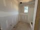 Bathroom with a tub, window and fresh drywall, ready for your fixtures and style at 145 Tee Dr, Selma, NC 27576