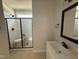 Modern bathroom with sleek shower, vanity with quartz counter, and matte black hardware at 145 Tee Dr, Selma, NC 27576