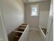 Bathroom featuring an unfinished vanity, a soaking tub, and a window, ready for final touches at 145 Tee Dr, Selma, NC 27576