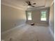 Spacious bedroom with abundant natural light and tray ceiling detail at 145 Tee Dr, Selma, NC 27576