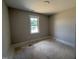 Cozy bedroom featuring a single window, neutral walls, and comfortable space at 145 Tee Dr, Selma, NC 27576