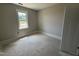 This bedroom has a window providing natural light, and fresh paint at 145 Tee Dr, Selma, NC 27576