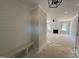 Inviting entryway featuring a built-in bench and open view into the living room with a fireplace at 145 Tee Dr, Selma, NC 27576