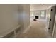 Bright entryway with a built-in bench, leading to a living area with a fireplace at 145 Tee Dr, Selma, NC 27576
