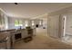 Bright kitchen with granite countertops and open view to the living room, perfect for gatherings at 145 Tee Dr, Selma, NC 27576